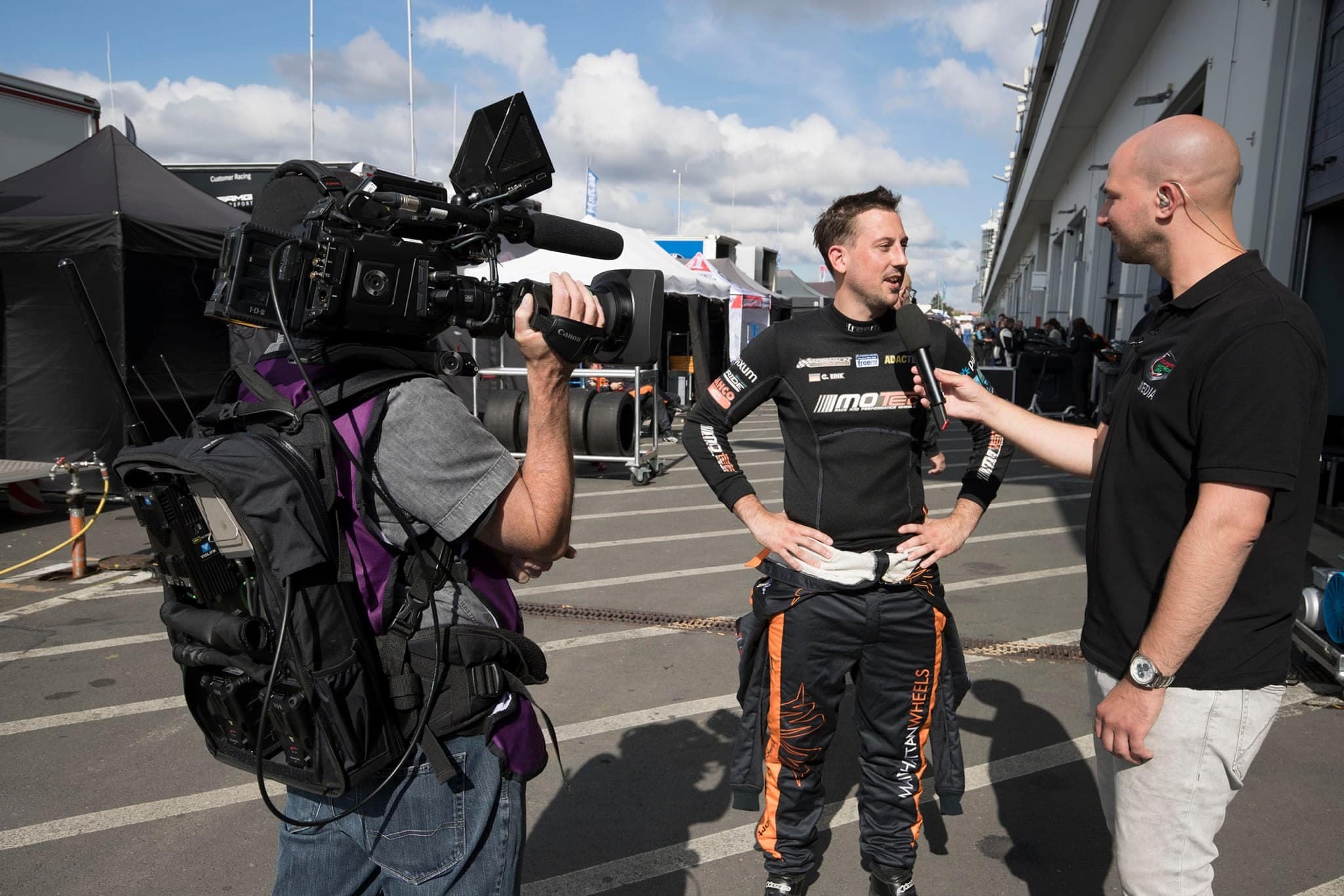Interview with a driver in the pit lane