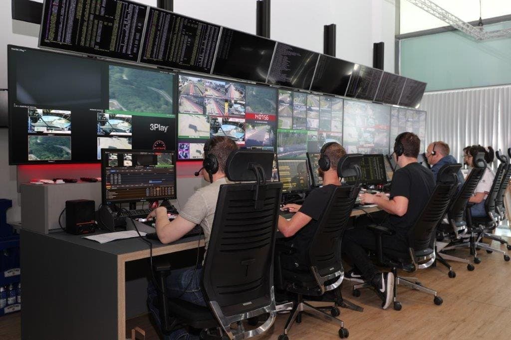 Gallery positions manned in front of the monitor wall